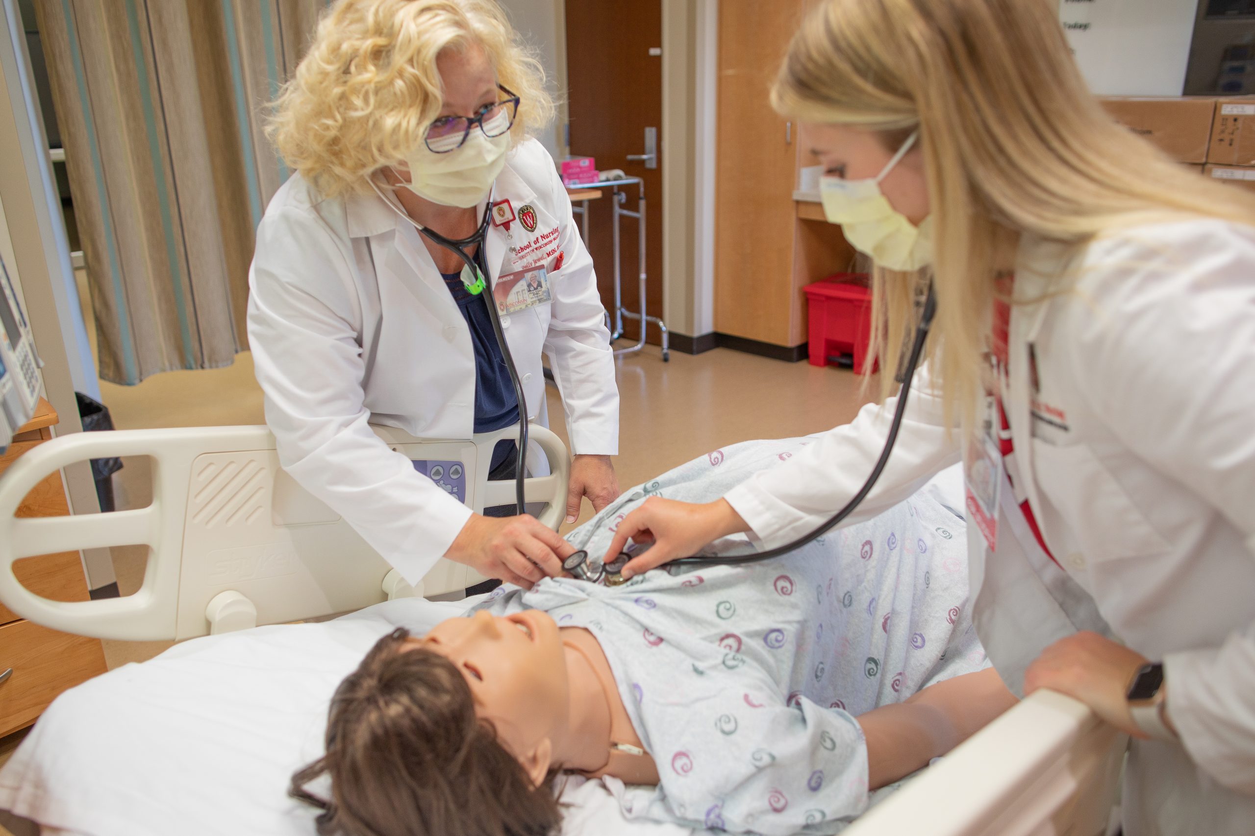A clinical nursing faculty member teaches students in the Center for Technology-Enhanced Nursing.