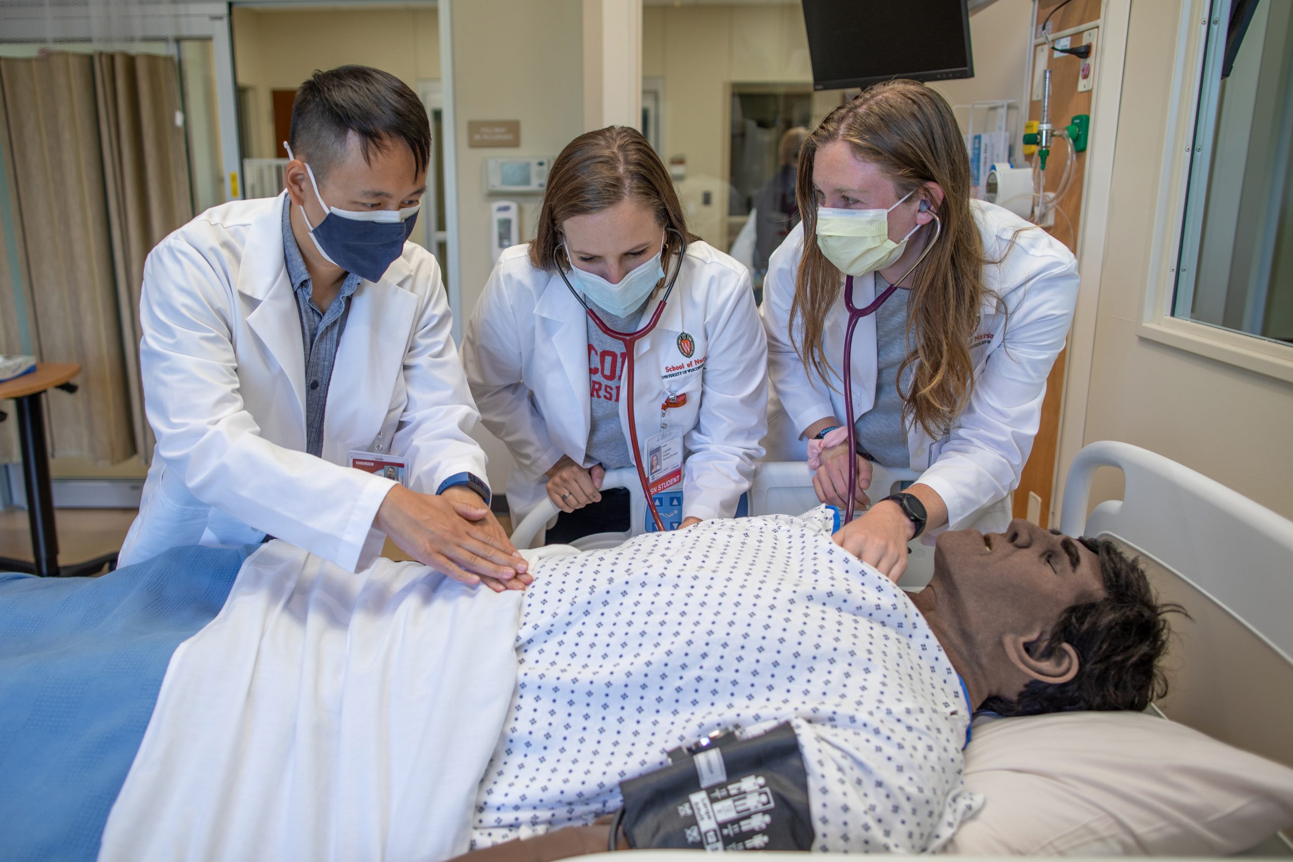 Students practice on a mannequin in the Center for Technology-Enhanced Nursing.
