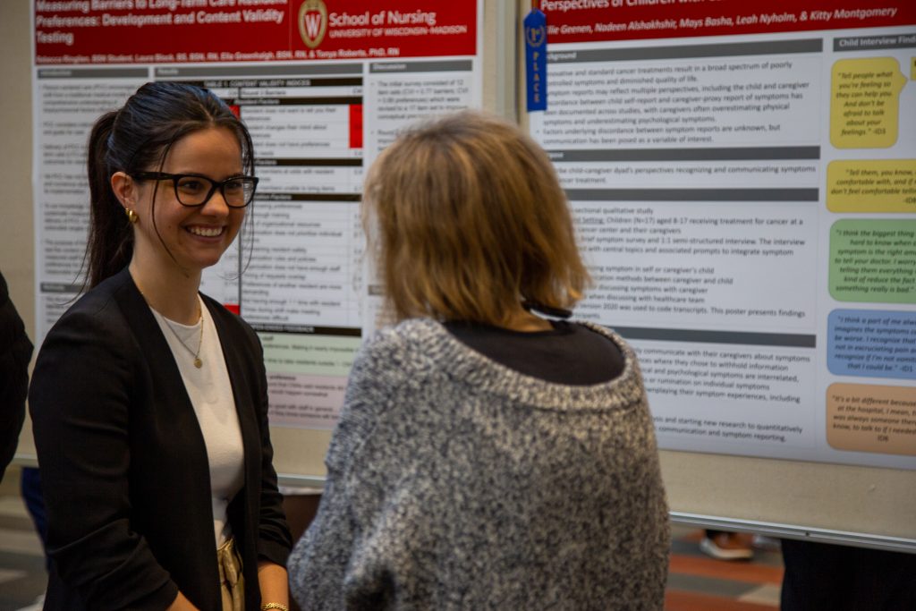 A student presents at the 2023 Nursing Poster Fair.