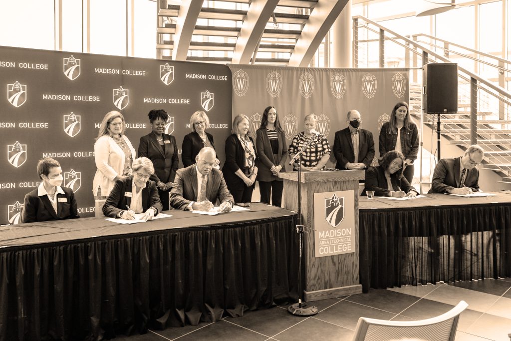 Members of both the UW–Madison School of Nursing and theMadison College Nursing School took part in a ceremonial signing of documents outlining the new partnership streamlining transfer requirements between Madison College and the School of Nursing's BSN@Home program. The event took place on Friday, May 6, 2022, at the Health Education and Information Technology Building on Madison College’s Truax Campus.