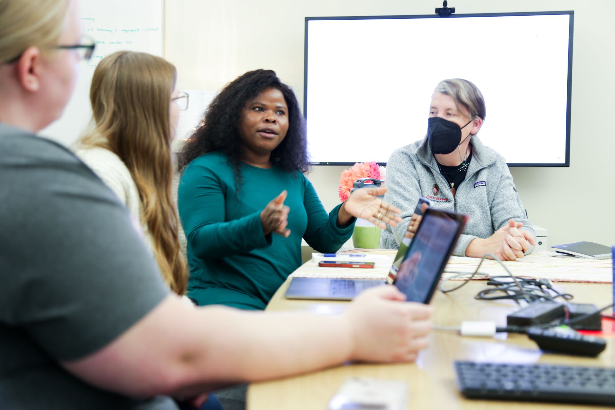 PhD students conduct research in their dedicated workspace in Cooper Hall.