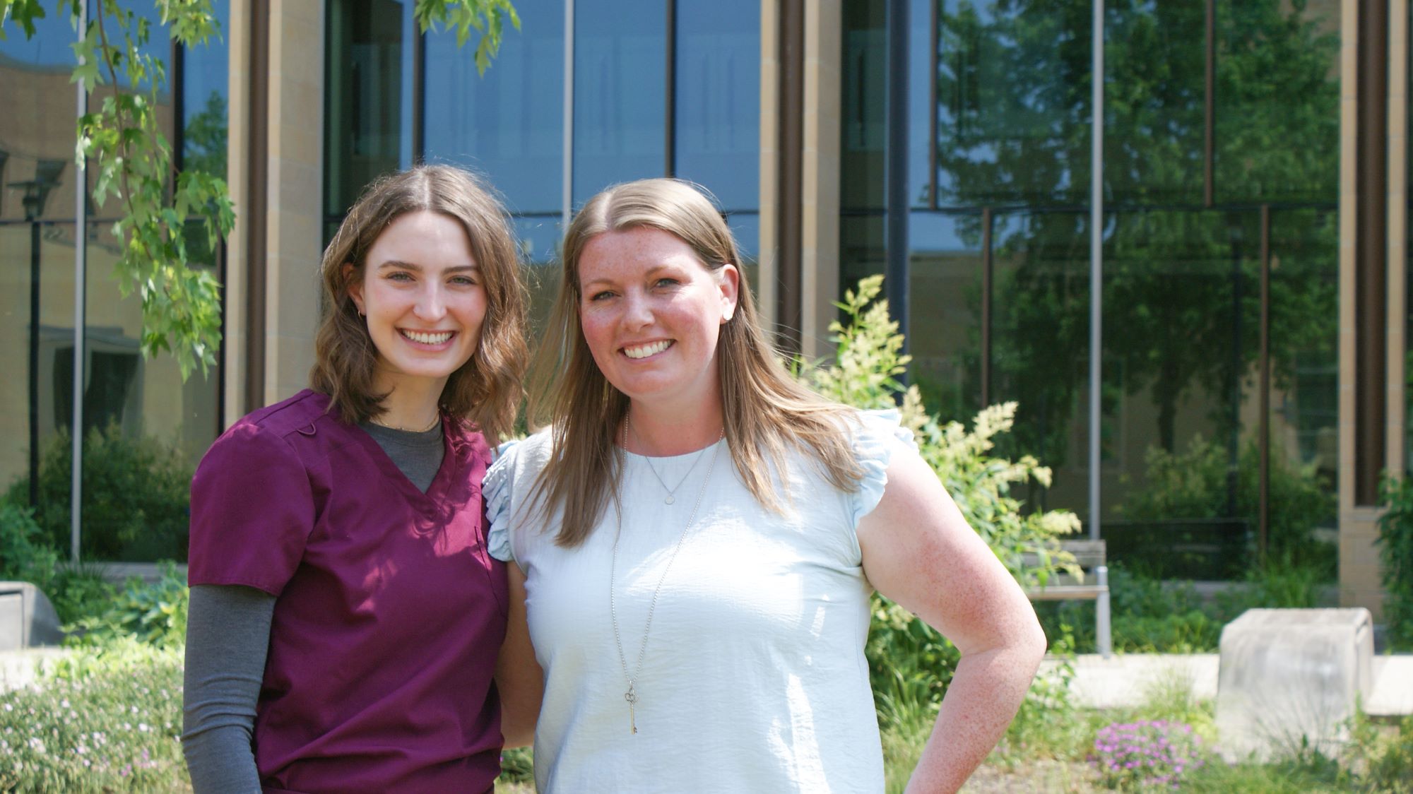 Jordan Langer with Emma Kowieski outside Signe Skott Cooper Hall.