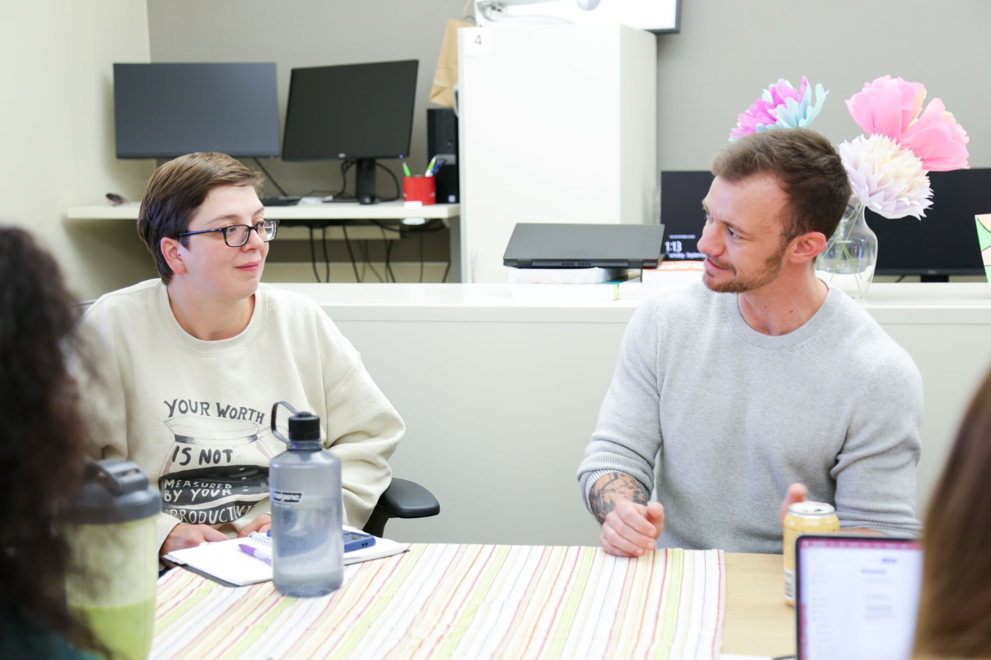 Dr. Elliot Tebbe talks with a student during class.