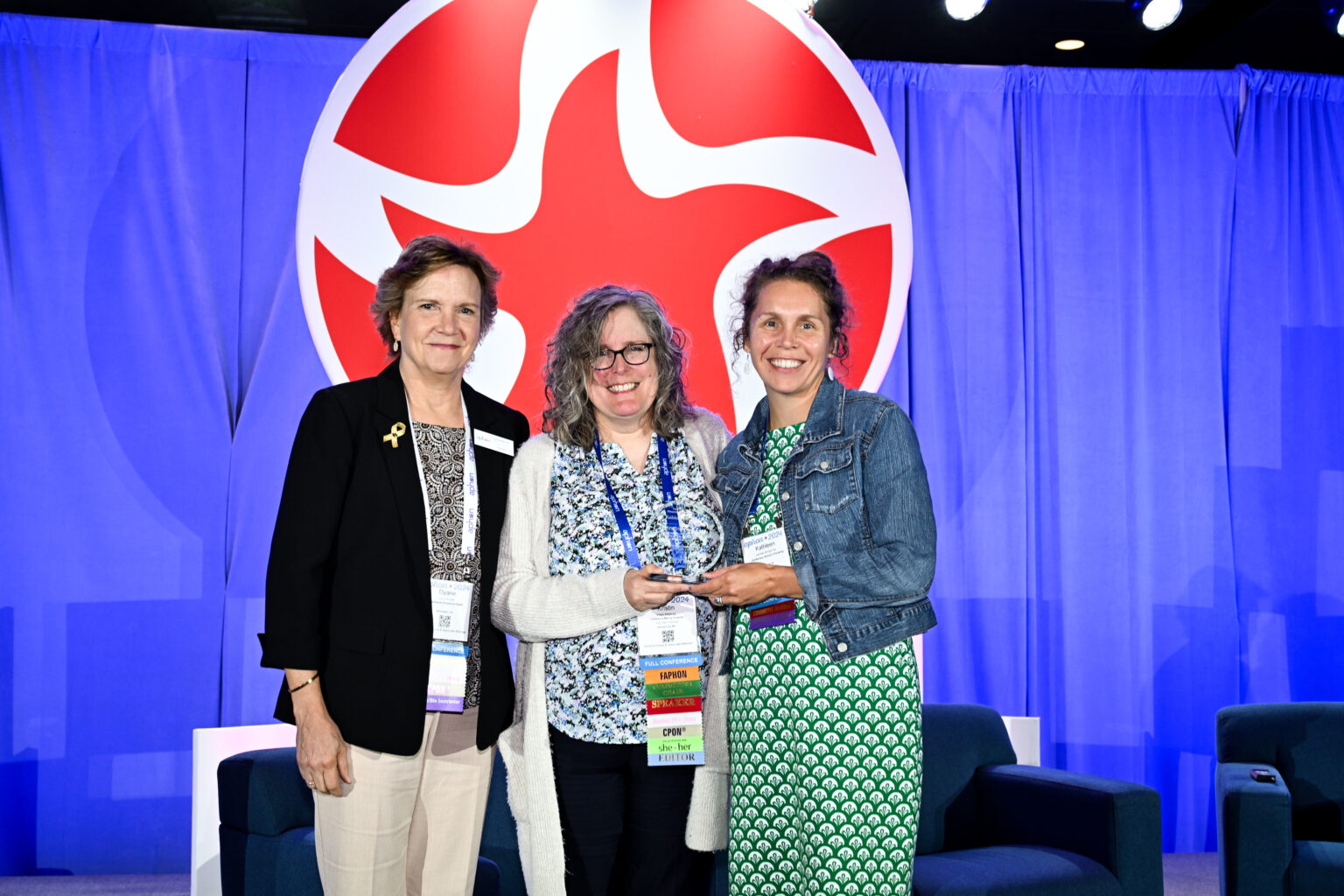Left to right: APHON President Dyane Bunnell and JOPHON Editor Kristin A. Stegenga and present Dr. Kitty Montgomery with the JOPHON award.