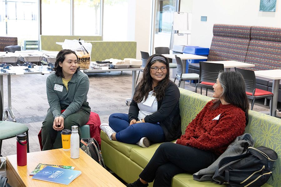Students and alumni talk at the School of Nursing health sciences reception.