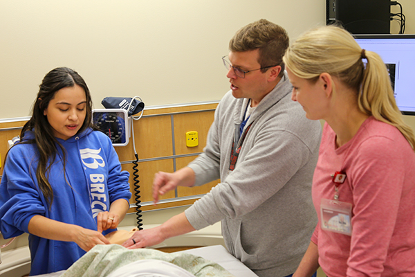 DNP acute care student hands-on learning from experts in the field.