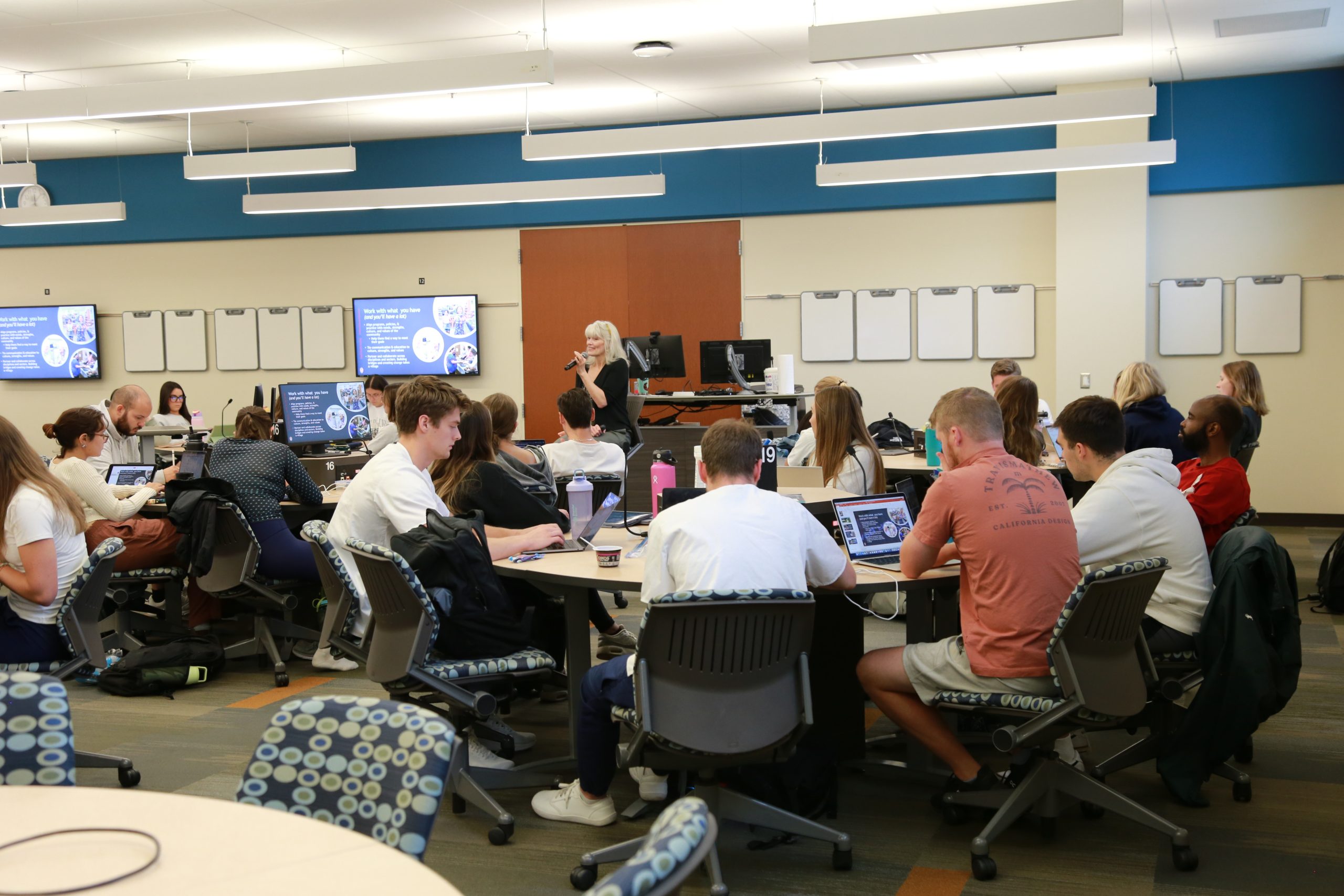 Students sit around a round table in the active learning classroom in Cooper Hall.