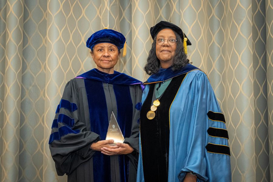 Linda D. Oakley receives the 2024 Canary Savage Girardeau award from Dean Linda D. Scott.