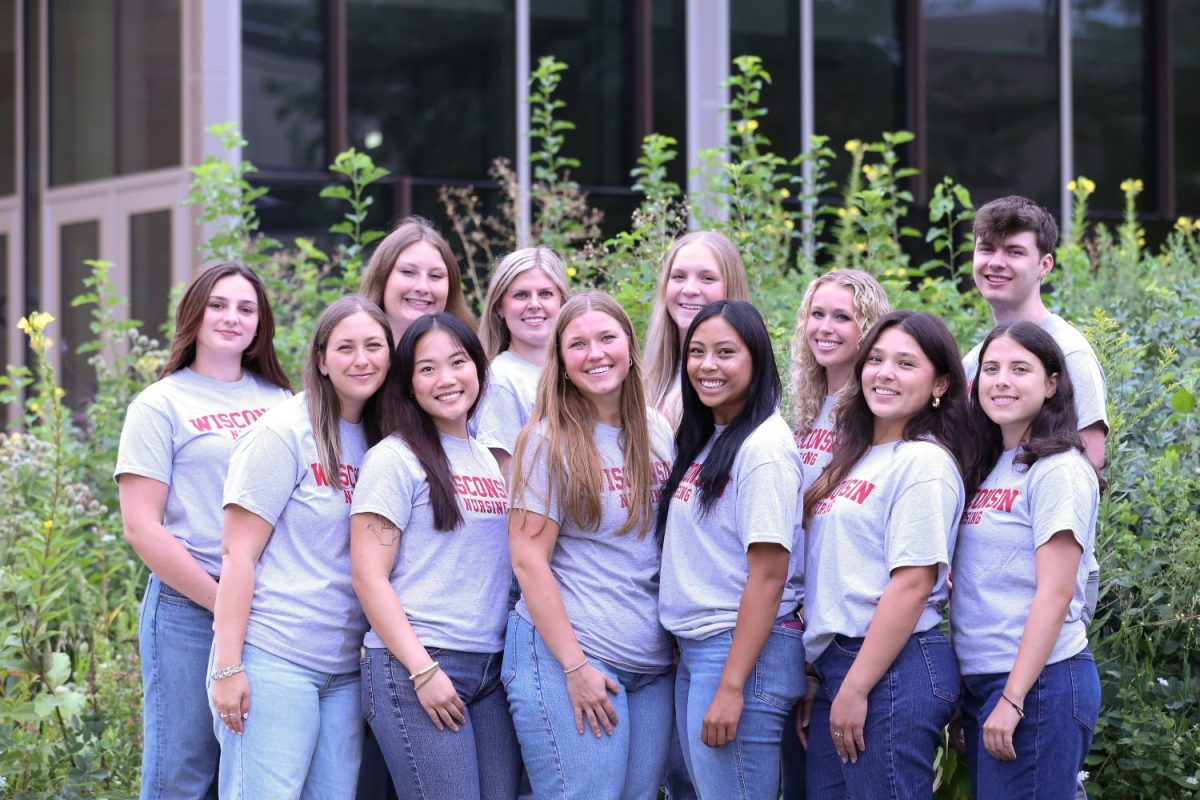 The 2025-26 student ambassadors pose in front of greenery next to Cooper Hall.