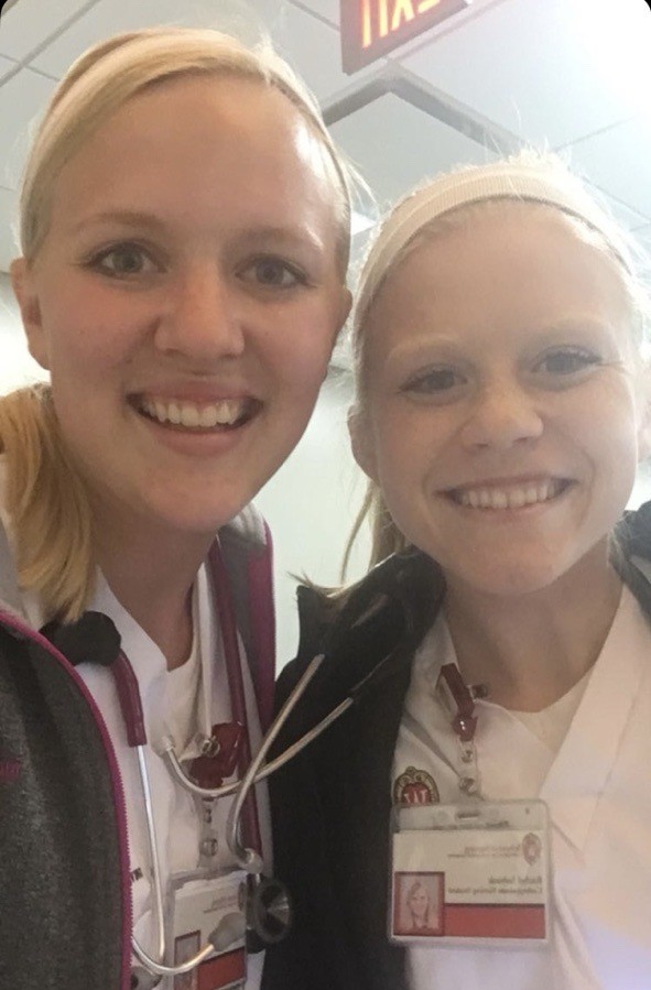 Stanek and a friend snap a selfie in scrubs during their BSN program.