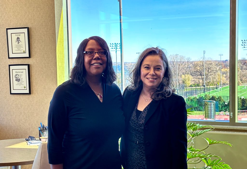 Linda D. Scott stands with Wisconsin Lieutenant Governor Sara Rodriguez in an office setting.