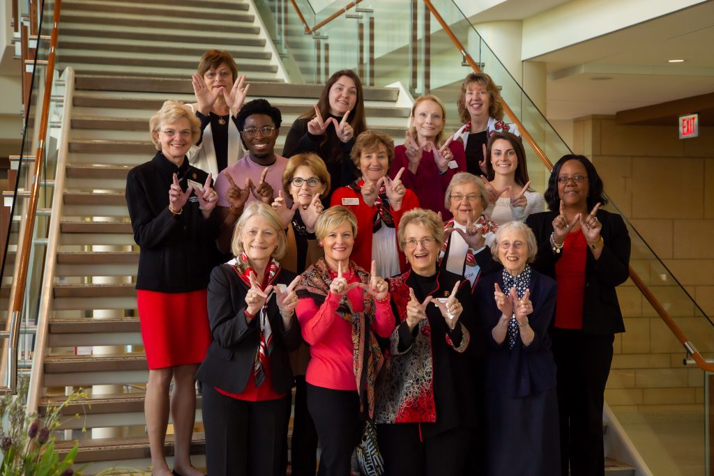 The 2019 Board of Visitors pose on the staircase at Cooper Hall.