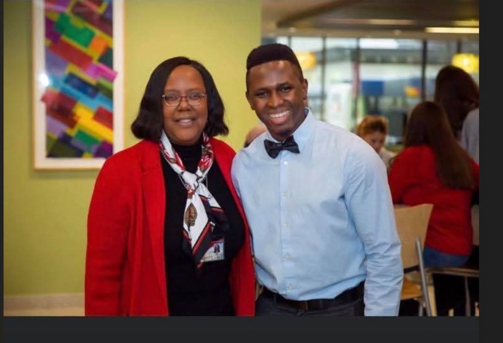 Linda D. Scott and Edriss Drammeh at his DNP graduation ceremony in 2020.