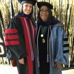 Jessica LeClair and Dean Scott in cap and gown at Dr. LeClair's graduation.