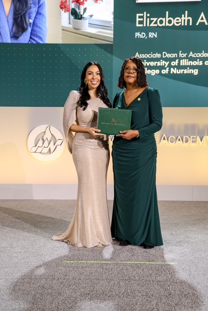 Dean Emerit Scott and Liz Aquino in gowns at the American Academy of Nursing.