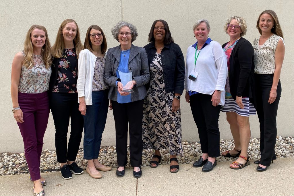 Dean Scott with Susan Zahner, Julianna Manske, and other colleagues.