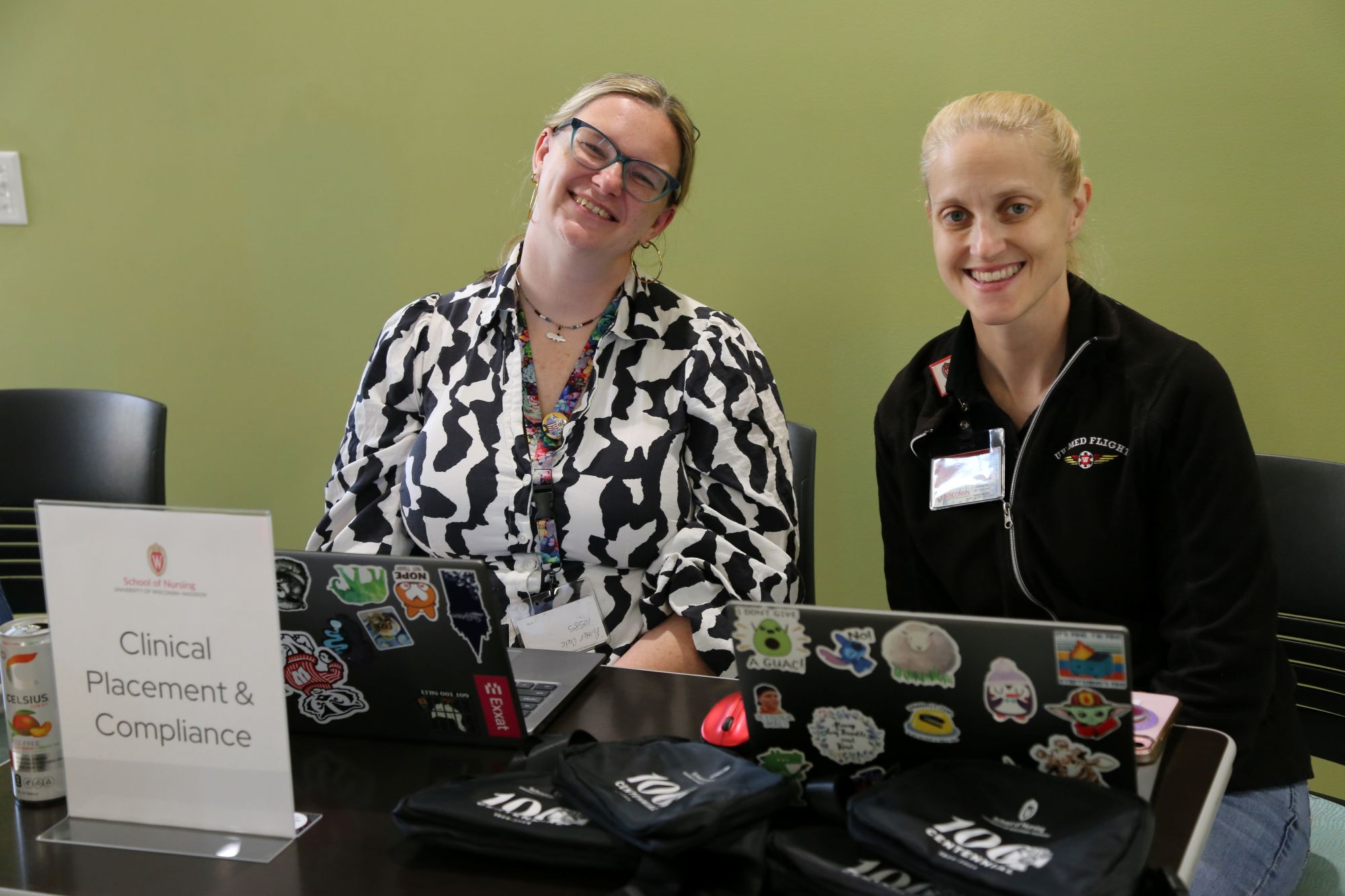 Clinical placement coordinators Rikki Klassy and Ann Johnson smile while tabling at the student resource fair.