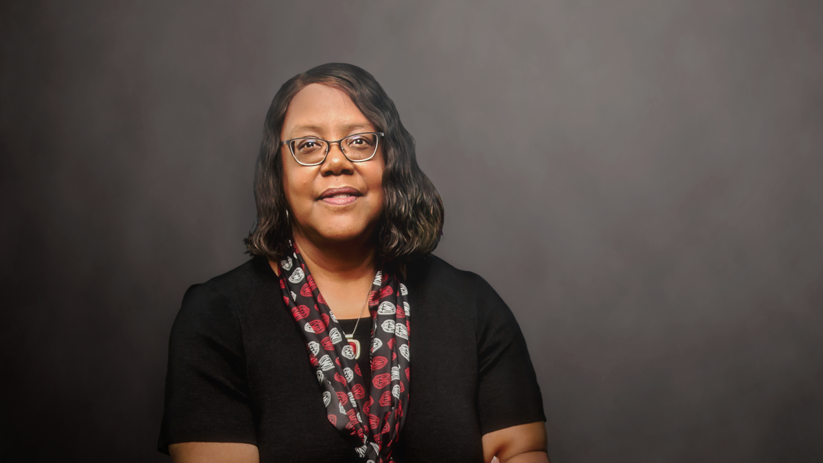 Headshot of Linda D. Scott against a gray background.