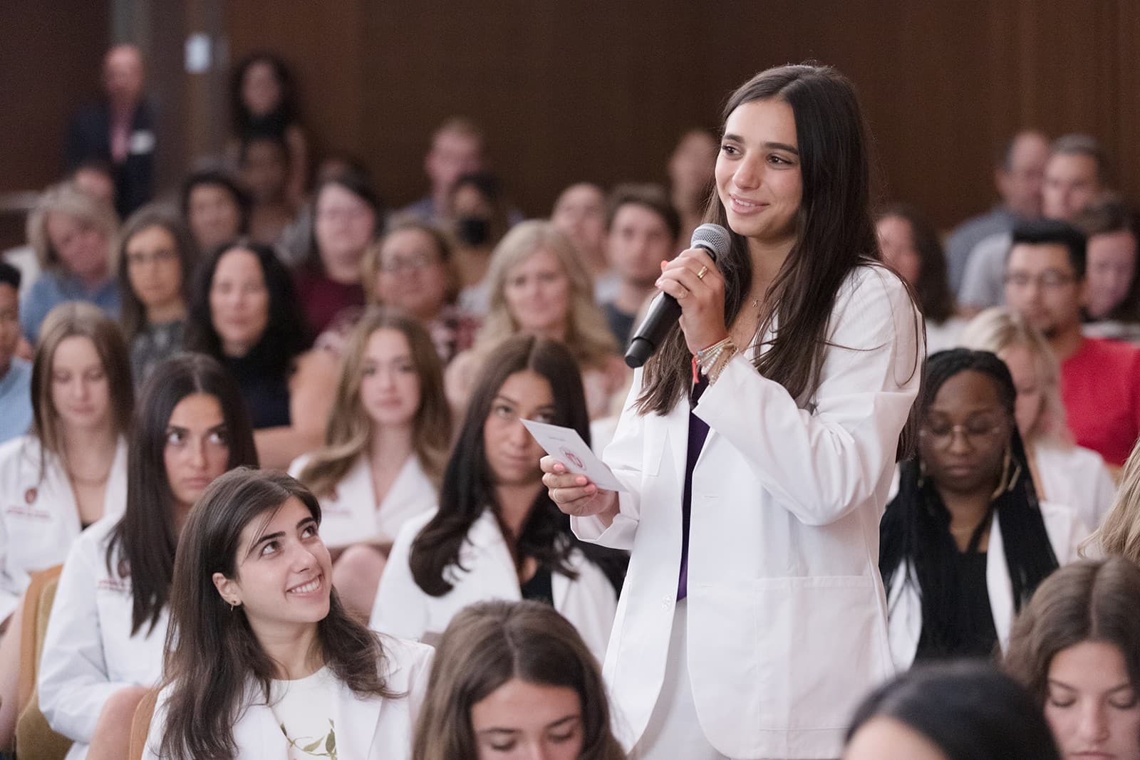 A student speaks at the 2022 School of Nursing White Coat ceremony.