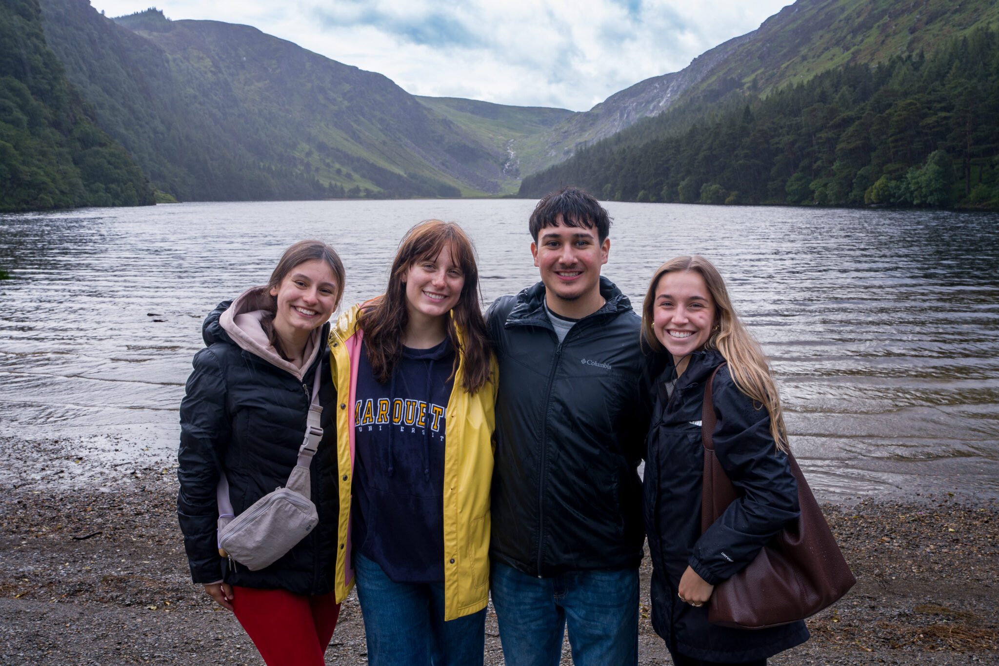 Mauro Barrera smiles with friends in front of the in front of the Wicklow Mountains during his Ireland immersion trip.
